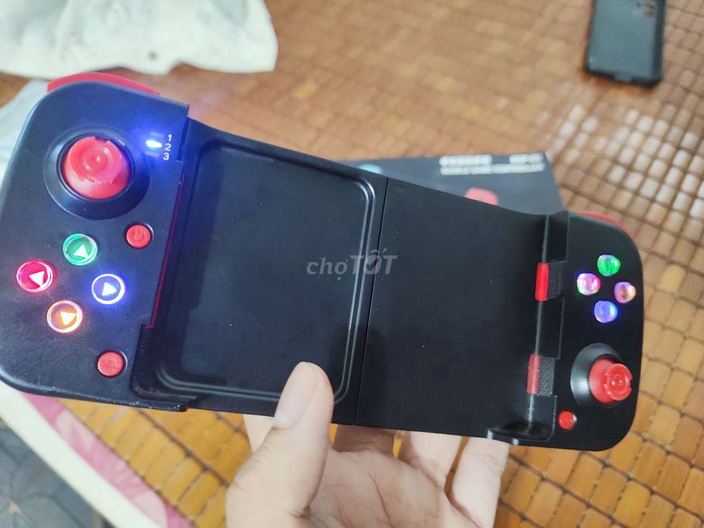 tay cầm kẹp điện thoại