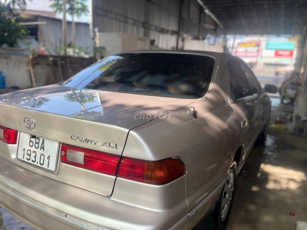Toyota Camry 1999 - 99999 km. Mua bán Ô tô tại Huyện Vũng Liêm Vĩnh Long được đăng bởi QUOC HUYNH hình 9
