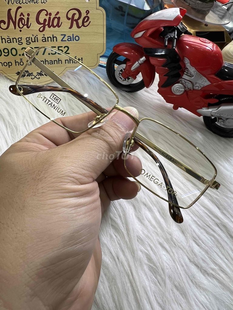 Gọng kính OMEGA Titan Vàng. Mua bán Phụ kiện thời trang khác tại Huyện Thanh Trì Hà Nội được đăng bởi Shop HaNoiGiaRe Com hình 1