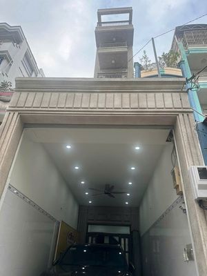 Nhà 1 trệt 5 lầu có thang máy Mặt Tiền đường Âu Cơ