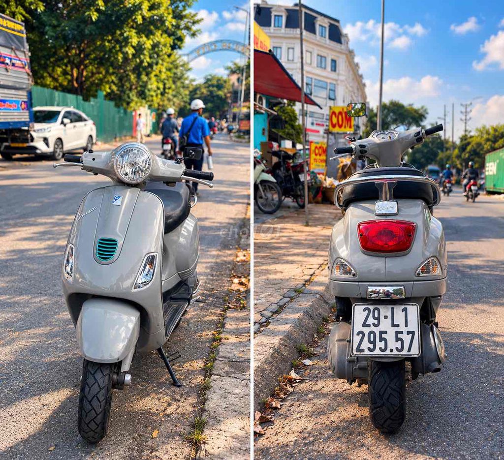 Серый скутер Piaggio Vespa