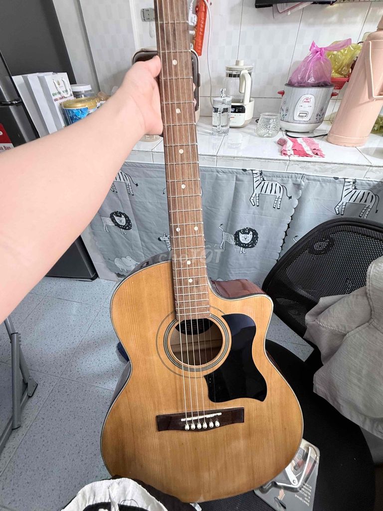 Đàn guitar gỗ màu nâu. Mua bán Nhạc cụ tại Thành phố Thuận An Bình Dương được đăng bởi lyly hình 1