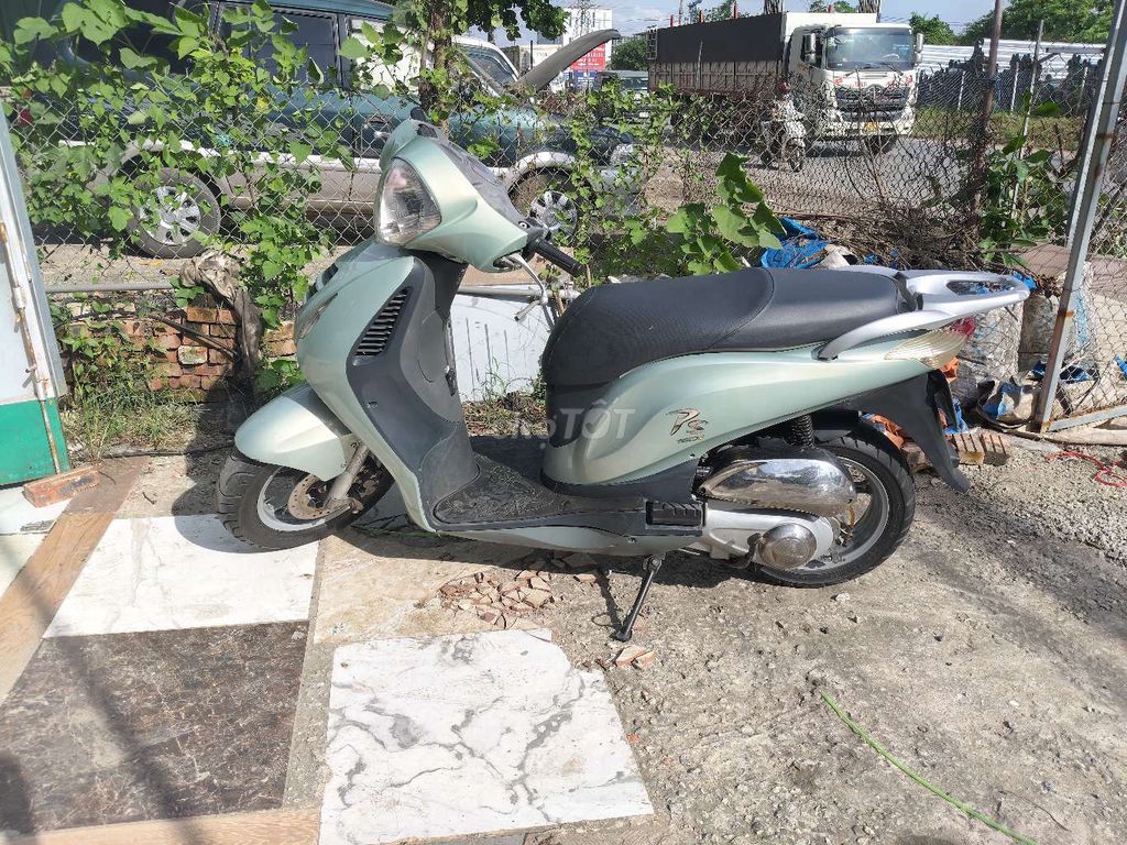 Мопед Honda PS 2009 зеленого цвета