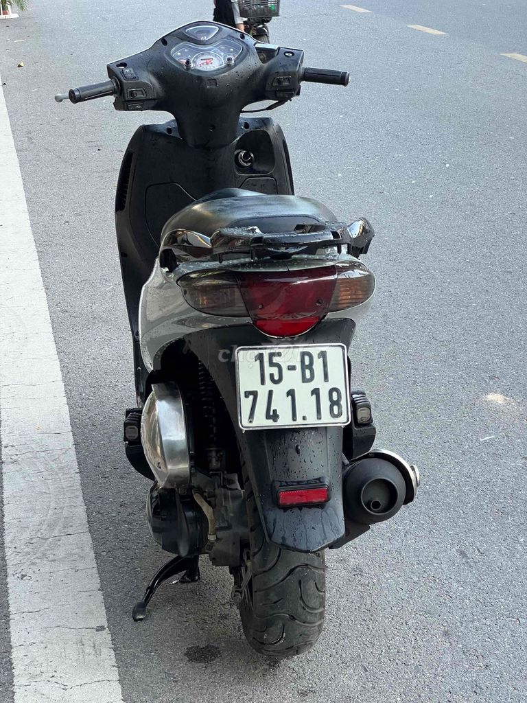 Серый скутер Honda PS