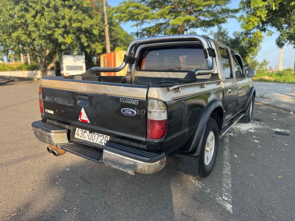 Форд Рейнджер XLT 2,5 л 4x4 MT 2004 Черное золото