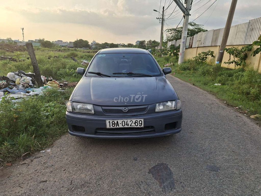 Mazda 323 1999 Xám Số sàn. Mua bán Ô tô tại Huyện Hóc Môn Tp Hồ Chí Minh được đăng bởi Nguyễn văn thắng hình 1