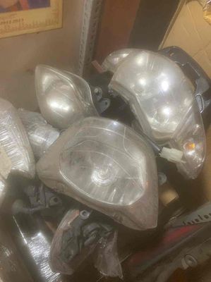 bán các loại đèn pha đèn lái xe máy và áo xe