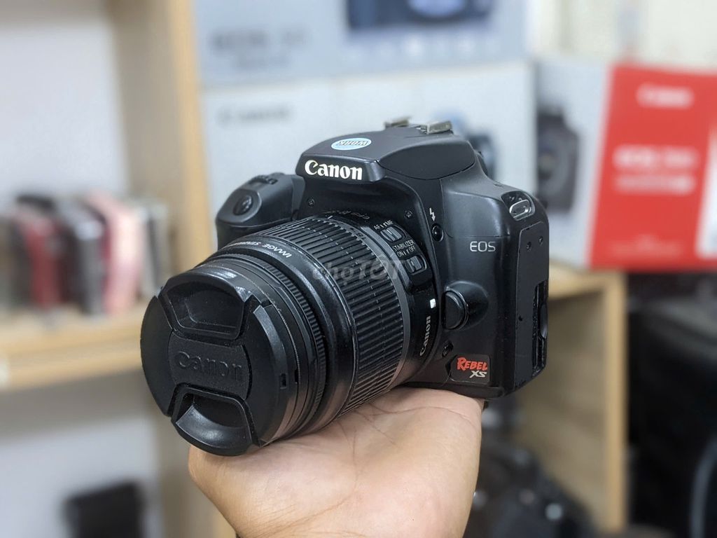 [Máy ảnh KTS] Canon 1000D ống kính 18-55mm đen. Mua bán Máy ảnh, Máy quay tại Quận 6 Tp Hồ Chí Minh được đăng bởi may anh KTS hình 1