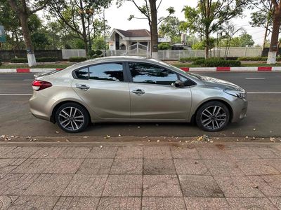 gd cần bán Kia Cerato 2016 STD Luxury Vàng cát