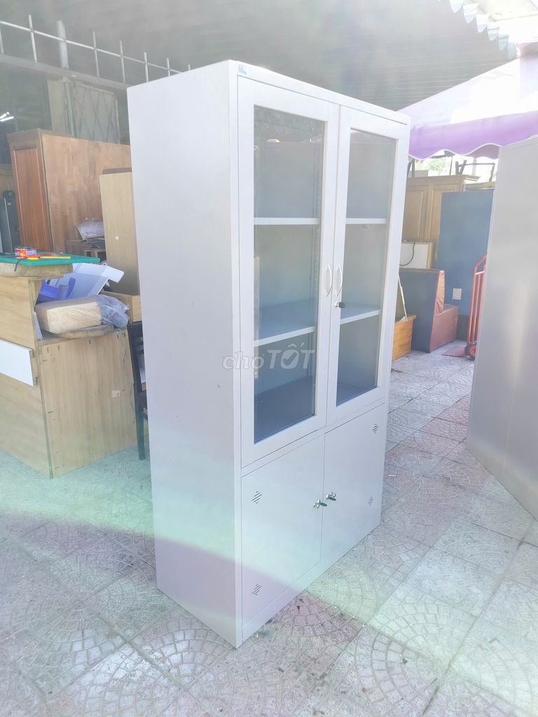 Tủ hồ sơ Hòa Phát Kim loại Kính Xám 2 cánh. Mua bán Đồ dùng văn phòng tại Quận Ngũ Hành Sơn Đà Nẵng được đăng bởi Đồ Cũ TTpro hình 1