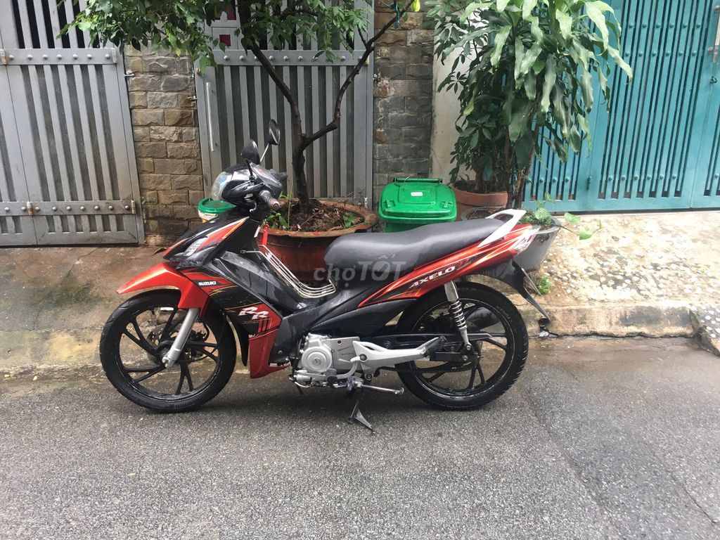Suzuki Axelo Đỏ đen. Mua bán Xe máy tại Quận Gò Vấp Tp Hồ Chí Minh được đăng bởi Trần Nhật Minh hình 1
