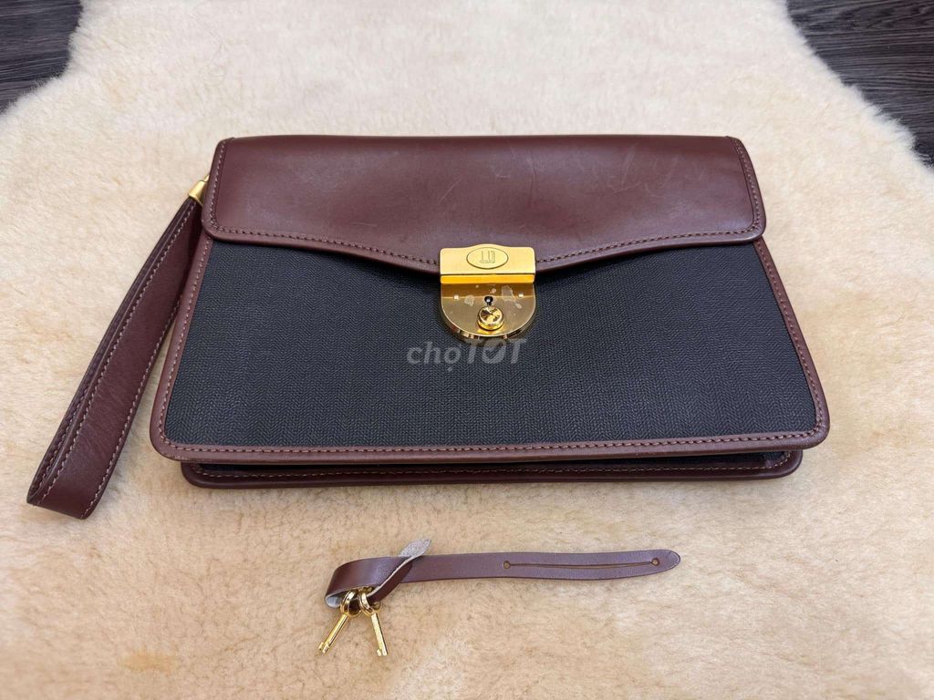 Clutch Dunhill made in Italy. Kt: 27x18cm. Khoá mạ