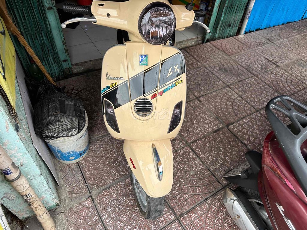 Piaggio Vespa LX 125 Vàng kem sơn zin bóng keng. Mua bán Xe máy tại Quận Phú Nhuận Tp Hồ Chí Minh được đăng bởi Thinhnguyen hình 1