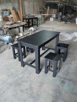 bàn ghế gỗ cố định sơn đen cho quán cơm mới 100%.