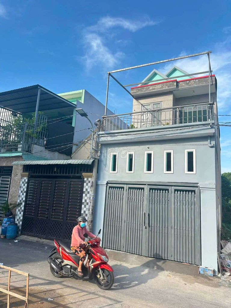 nhà lầu gần chợ dĩ an 1 