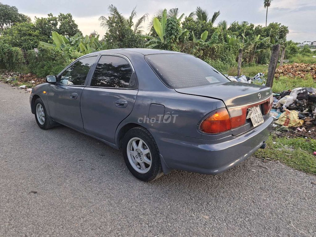 Mazda 323 1999 Xám Số sàn. Mua bán Ô tô tại Huyện Hóc Môn Tp Hồ Chí Minh được đăng bởi Nguyễn văn thắng hình 3