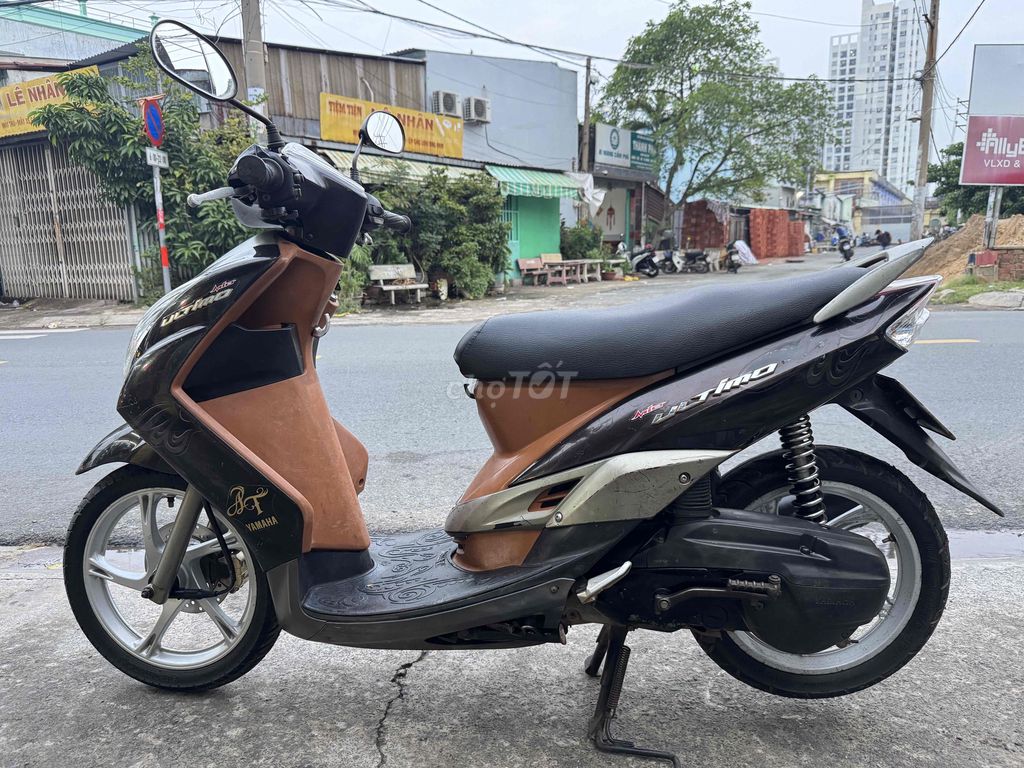 Скутер Yamaha Mio коричневый