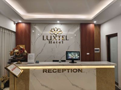 LUXTEL HOTEL logo